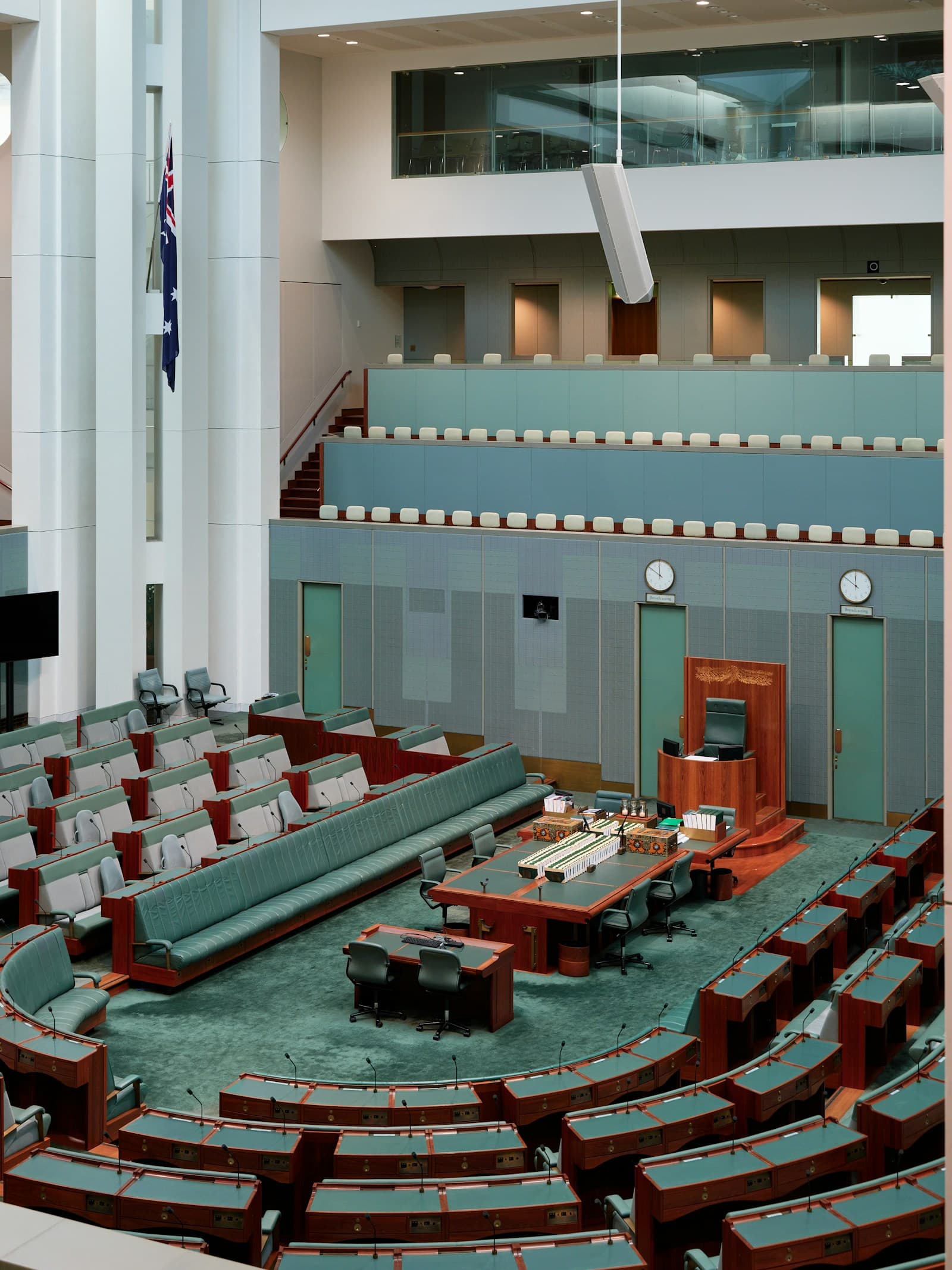 Rows of empty desks and seats in a debating chamber